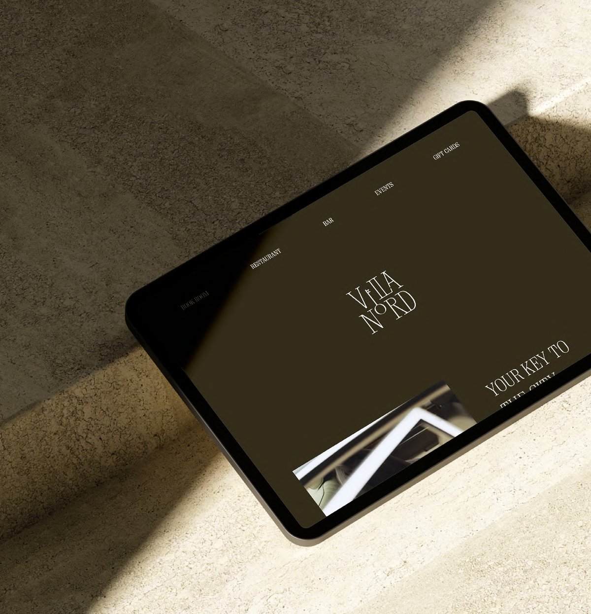 A tablet showing the Villa Nord gift card with the words Your key to the city.