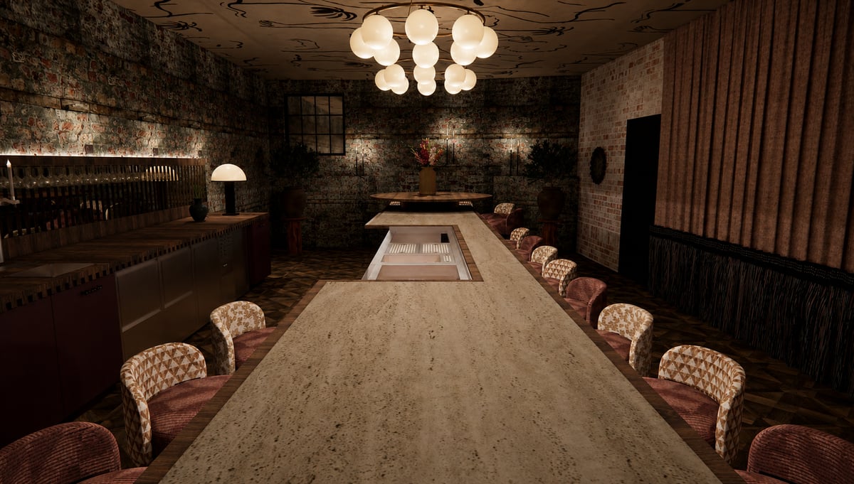 One long table with patterned chairs under a chandelier, in the room behind the bookcase at Bespoke 1837.